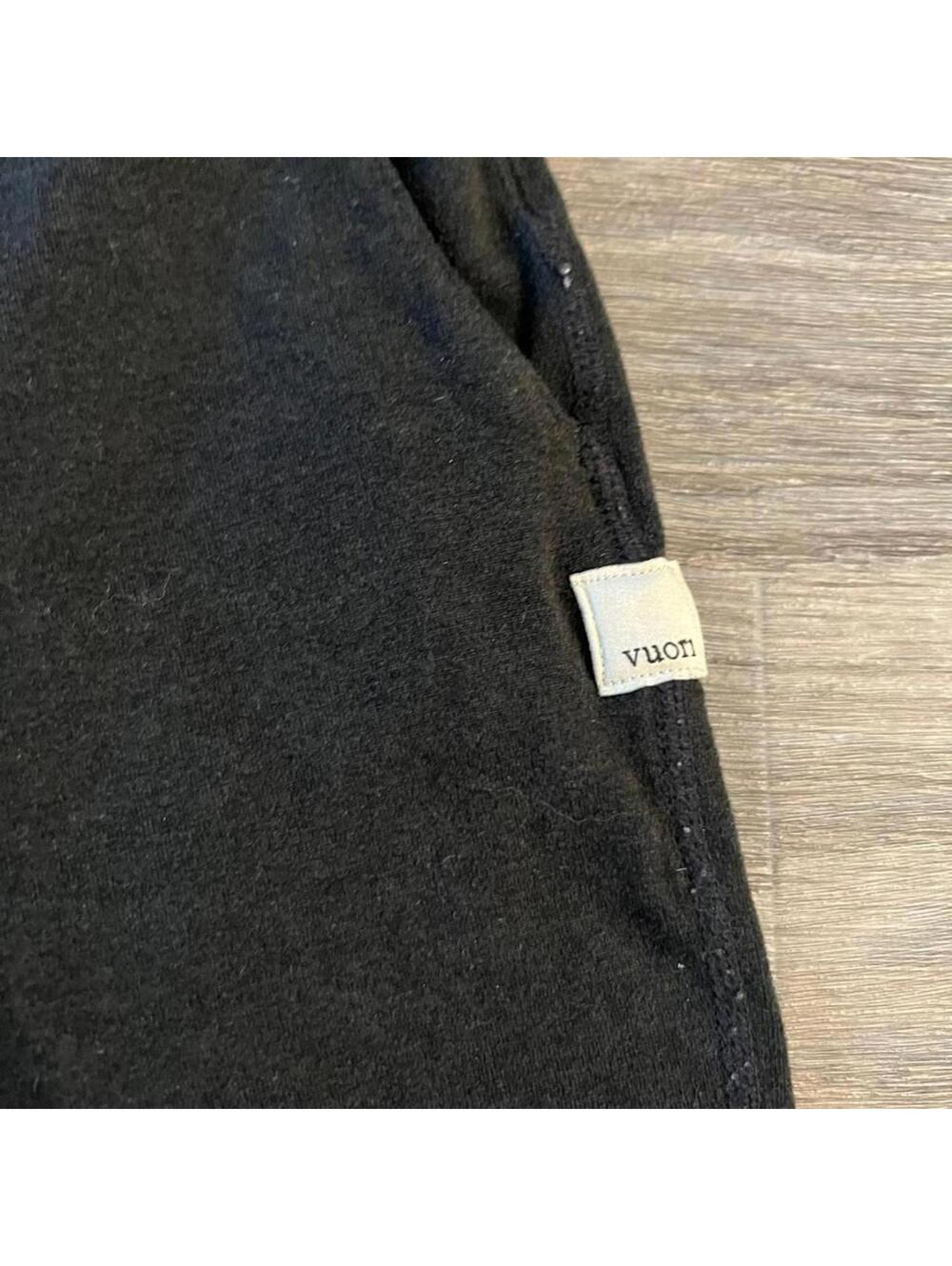 black Vuori shorts with drawstrings